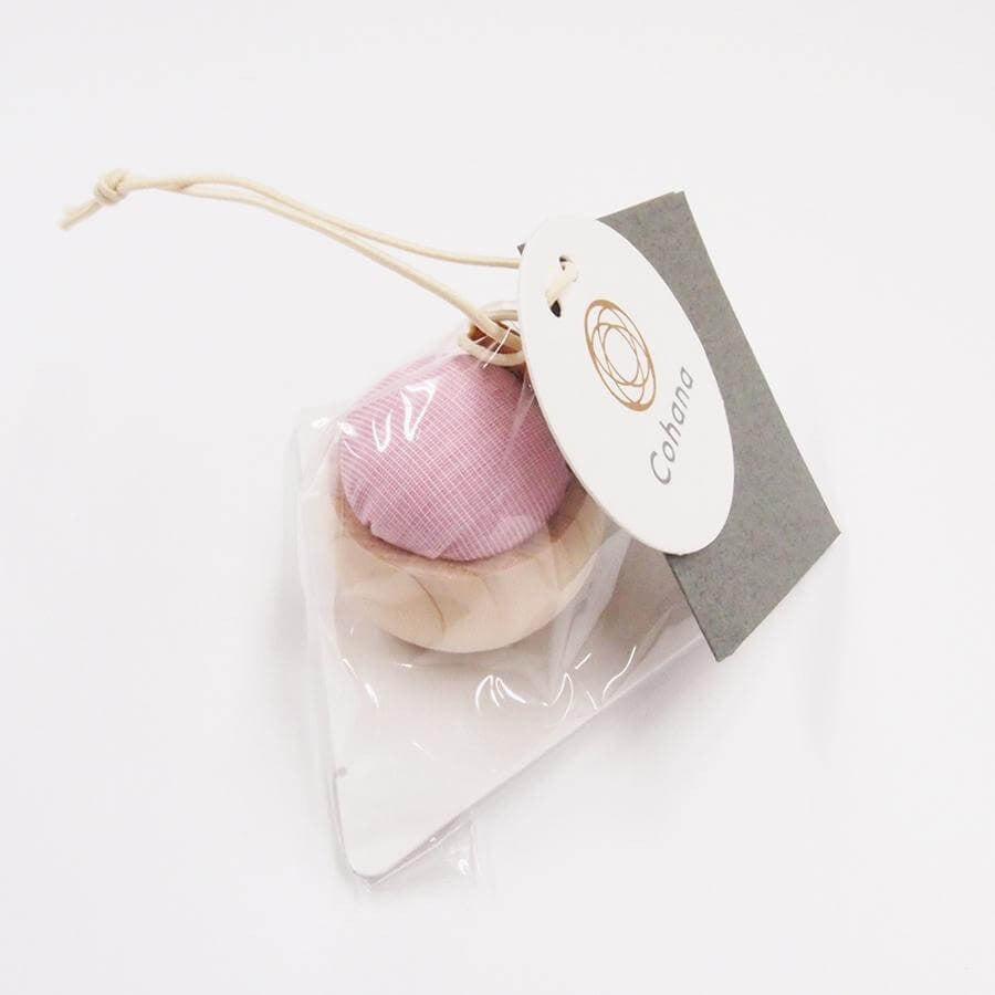 Cohana pincushion in clear packaging against white background