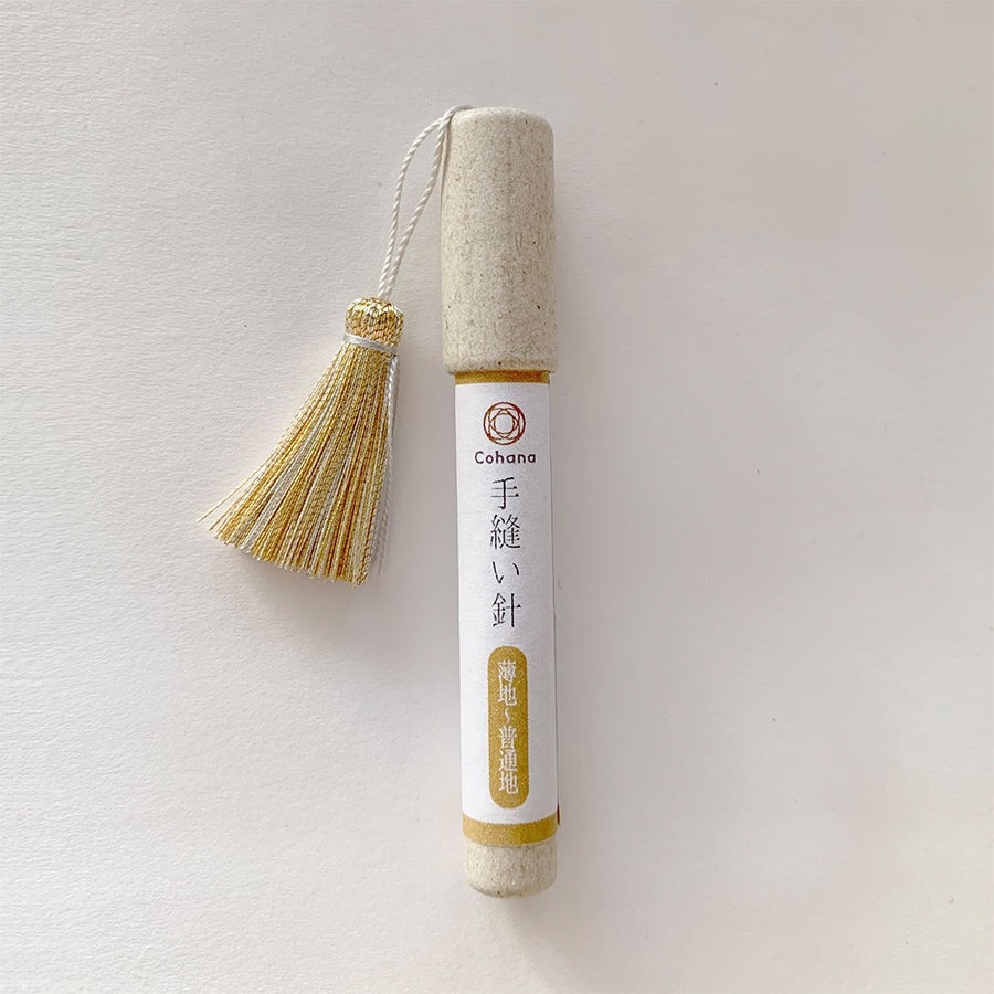 Cohana sewing needles in cardboard tube case with yellow tassel on lid