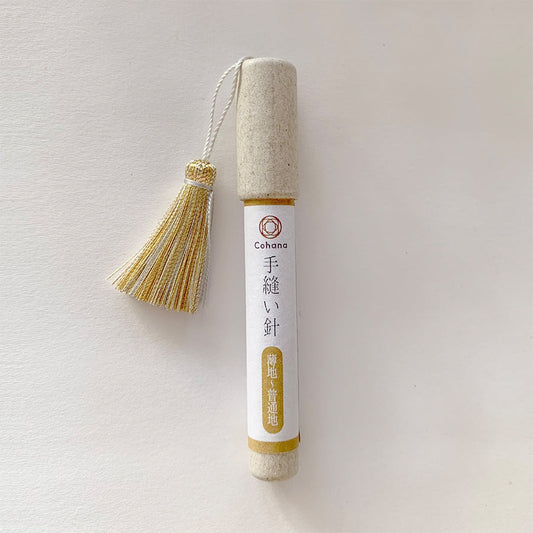 Cohana sewing needles in cardboard tube case with yellow tassel on lid