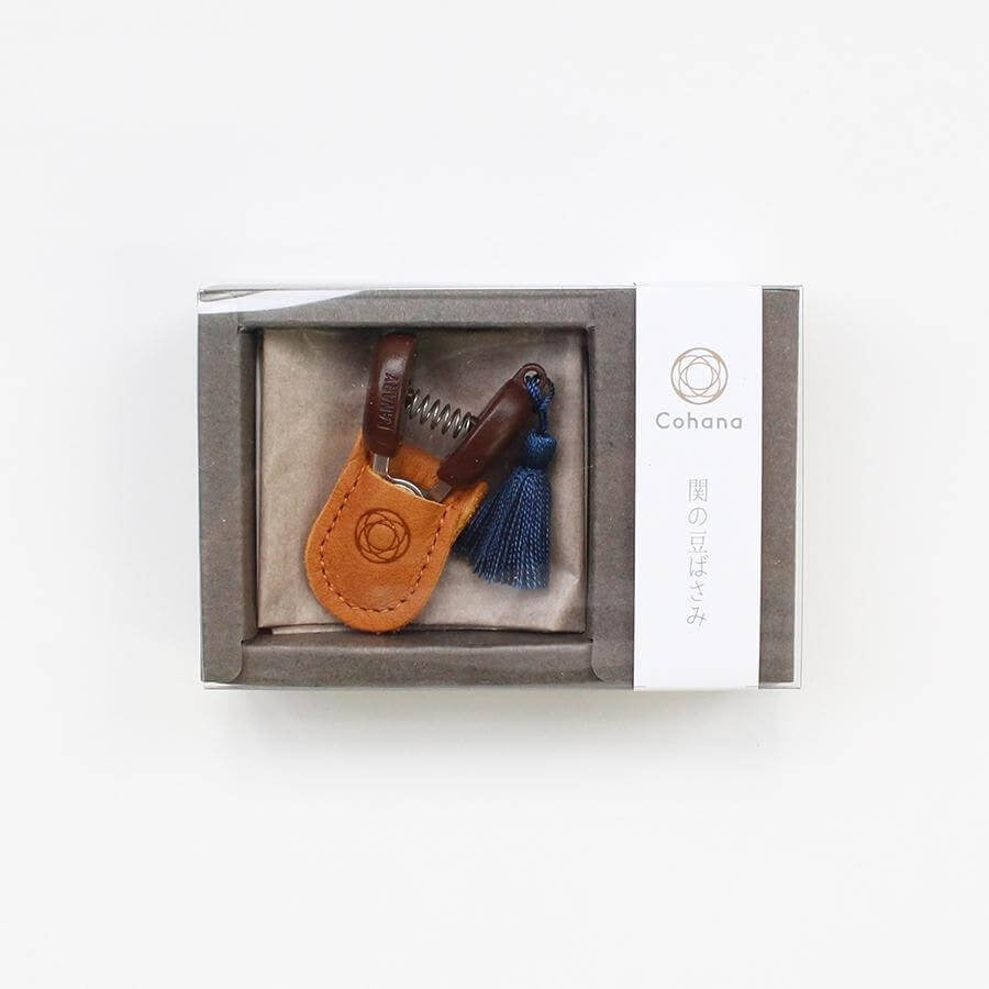 Boxed mini sewing scissors with blue tassel and leather pouch