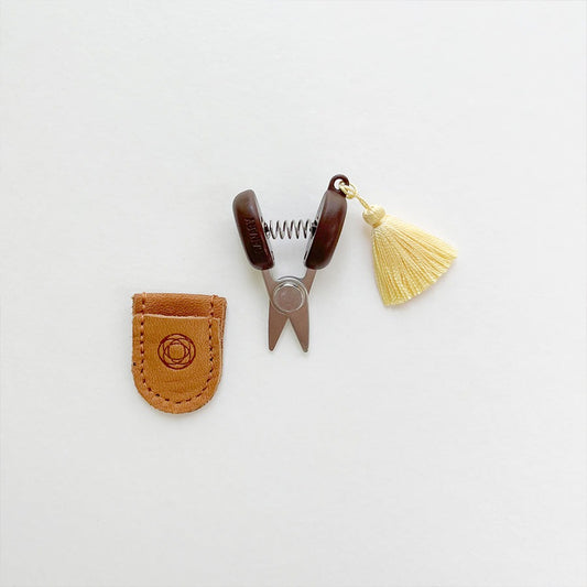 Mini sewing scissors with yellow tassel and leather case