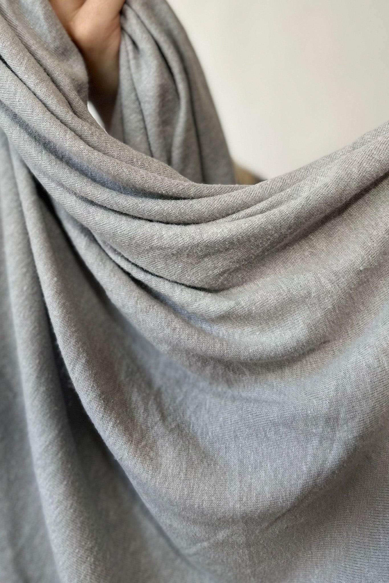 Close up of grey hemp and lyocell jersey knit fabric in grey