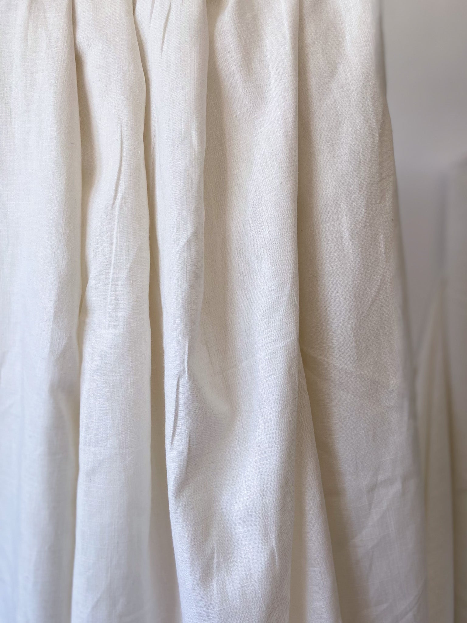 Close up of natural white organic cotton and hemp woven sewing fabric