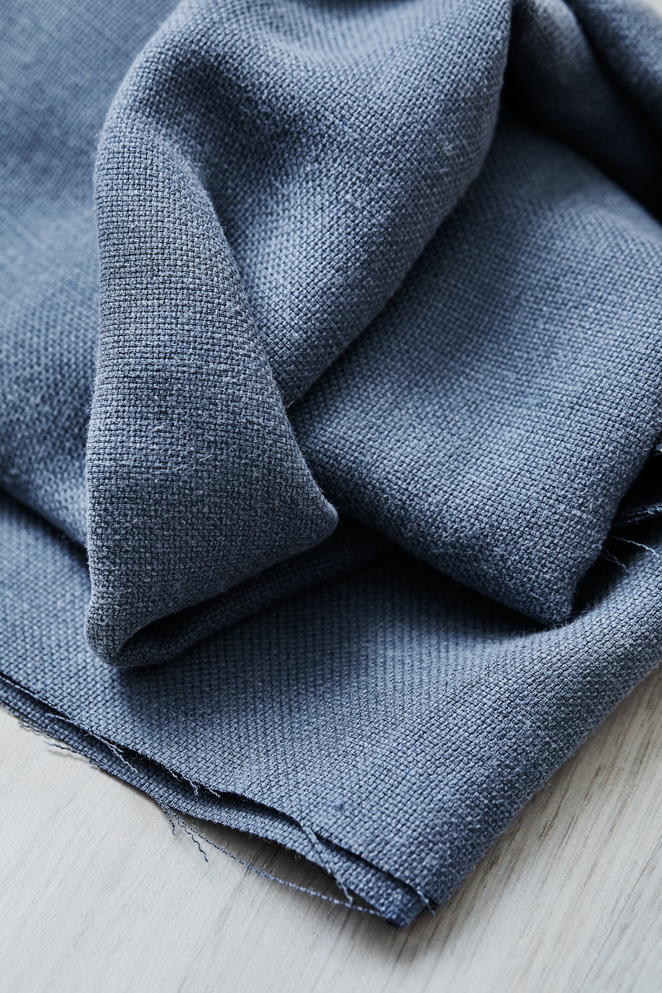 Close up of Mara linen blend tencel sewing thread in dusty blue