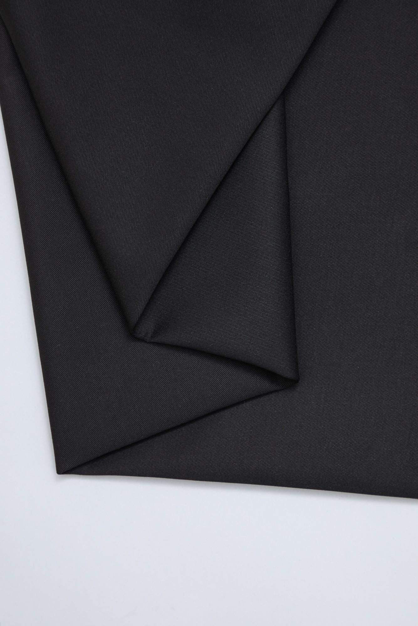 Flat lay of organic cotton twill fabric in colour black