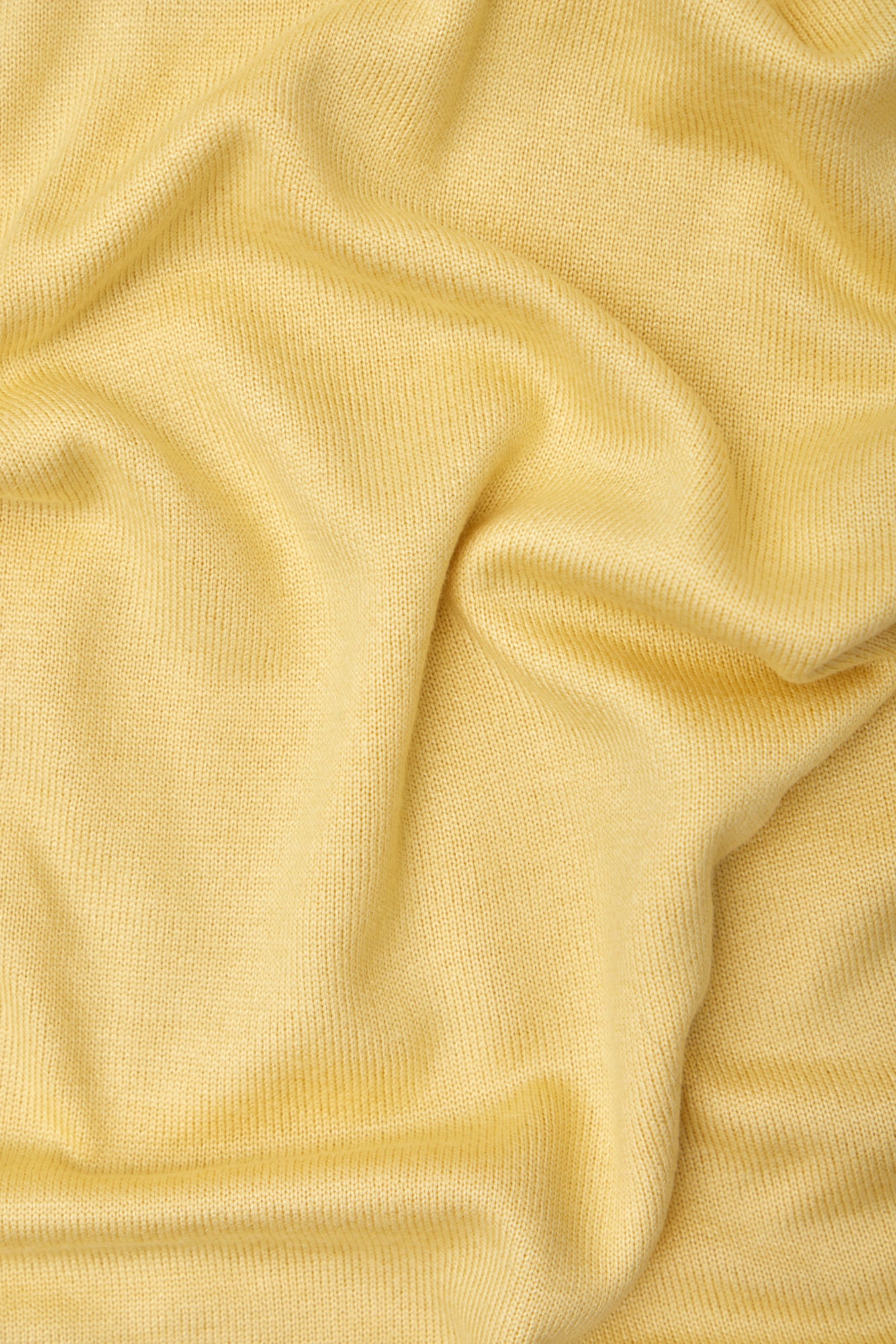 Close up of yellow Ecovero knit sewing fabric