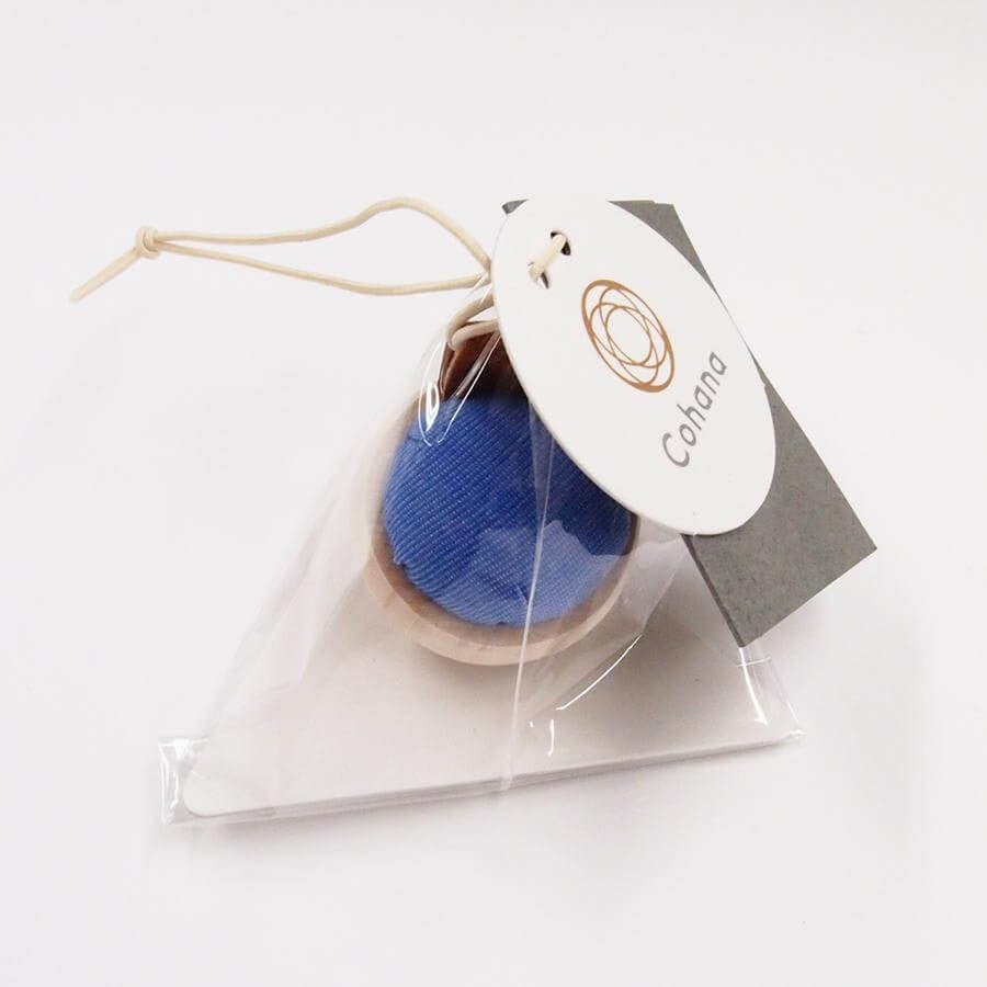 Packaged blue and wooden cohana pin cushion