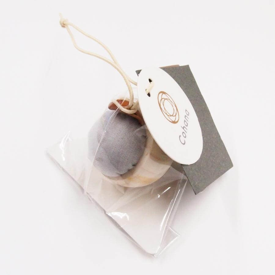 Cohana pin cushion in clear packaging against white background