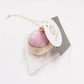 Cohana pincushion in clear packaging against white background