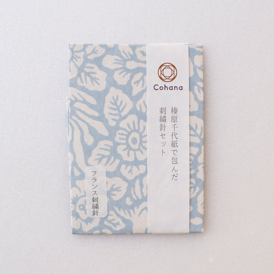 Pack of embroidery needles covered in patterned Japanese washi paper in pale blue and white