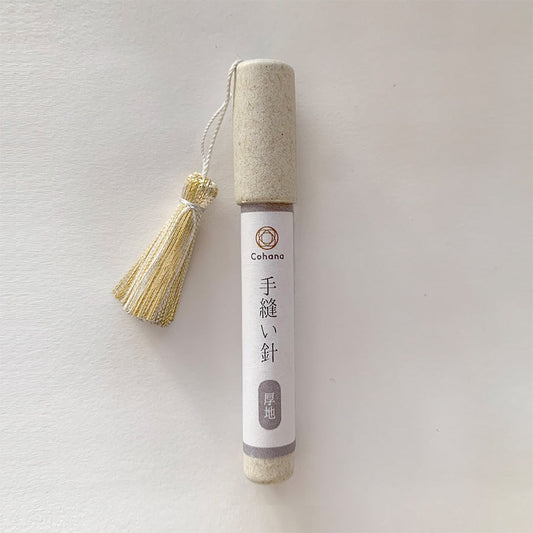 Cohana needles in cardboard tube with tassel attached to lid