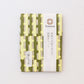Cohana embroidery needles in light green and dark green patterned washi paper