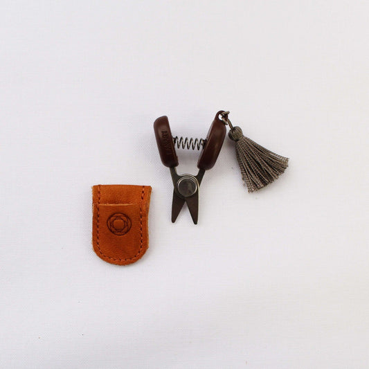 Mini sewing scissors with grey tassel and brown leather case