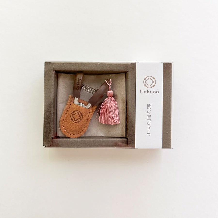 Boxed mini sewing scissors with pink tassel and leather case