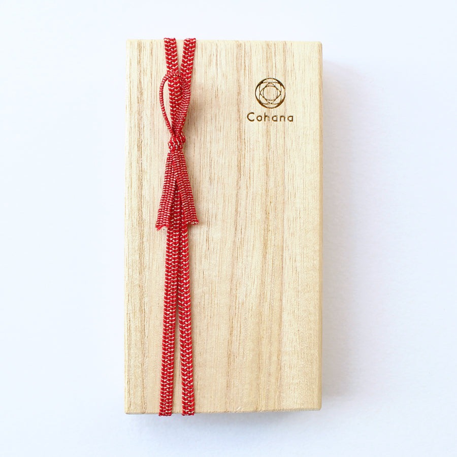Wooden cohana box with red ribbon