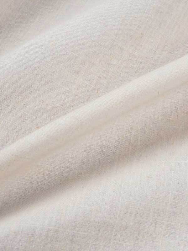 Ultra close up of organic cotton and hemp woven sewing fabric in natural white
