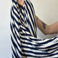 Hemp and lyocell navy/white stripe knit jersey fabric hanging in hand