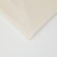 Close up of organic cotton and tencel knit sewing fabric in cream