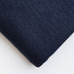 Close up of navy organic cotton and tencel jersey sewing fabric