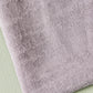 Close up of Hoya jacquard linen blend sewing fabric in purple haze