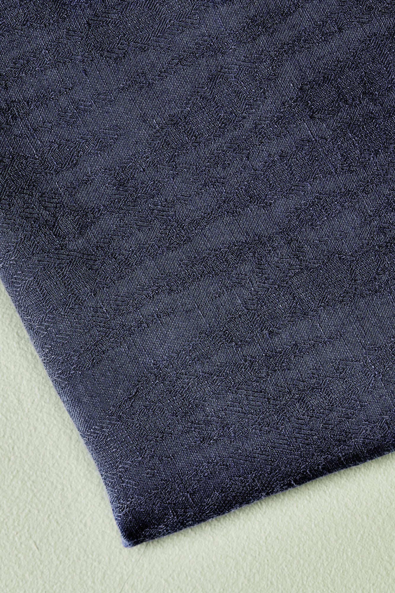 Close up of navy linen and tencel blend sewing fabric