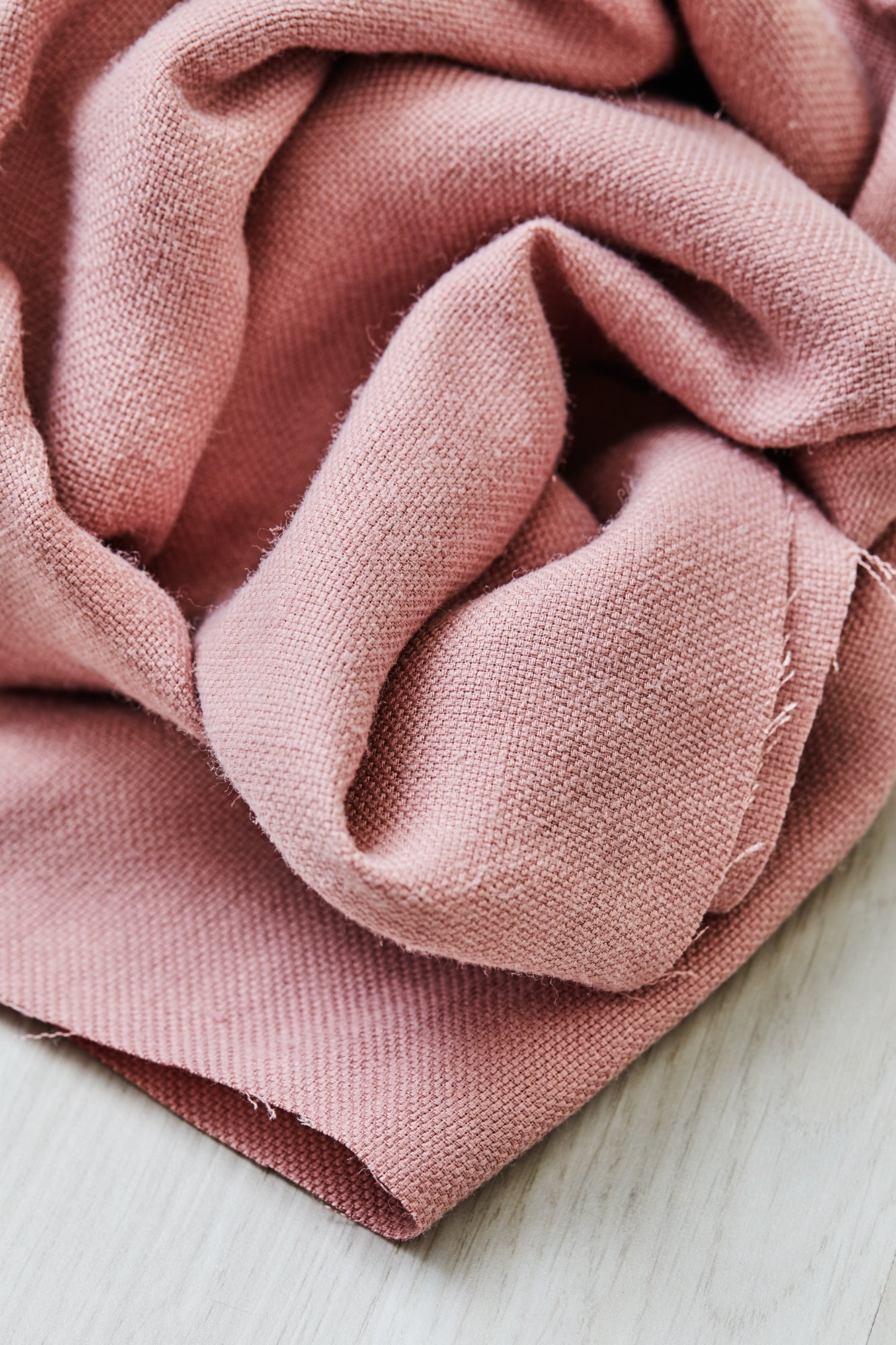 Close up of Mara linen blend tencel sewing fabric in puff (pink)