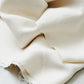 Close up of Mara linen blend tencel sewing fabric in shell (cream)