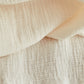 Close up of organic cotton double gauze fabric in creamy white