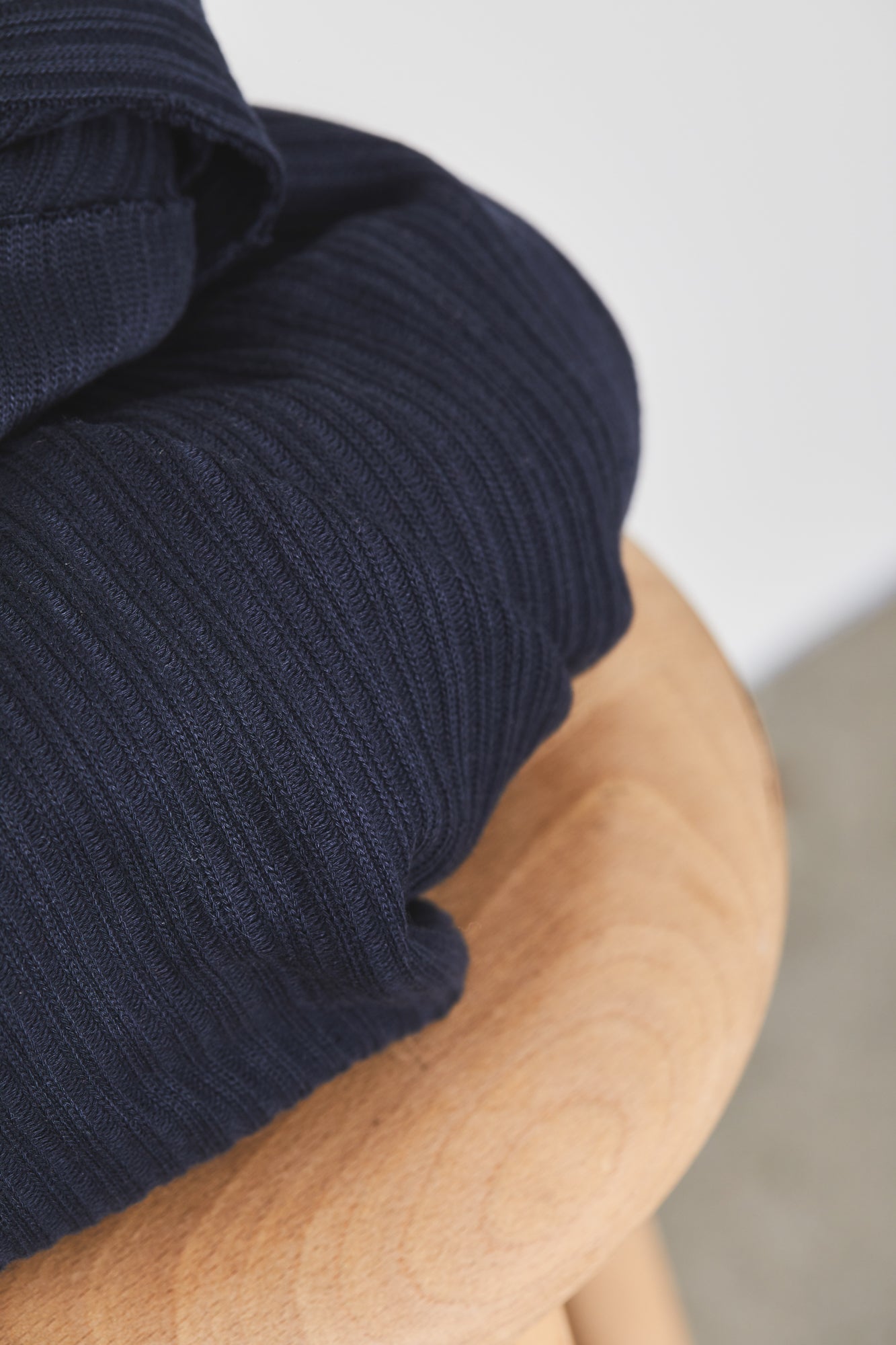 Close up of organic cotton chunky rib knitted fabric in navy