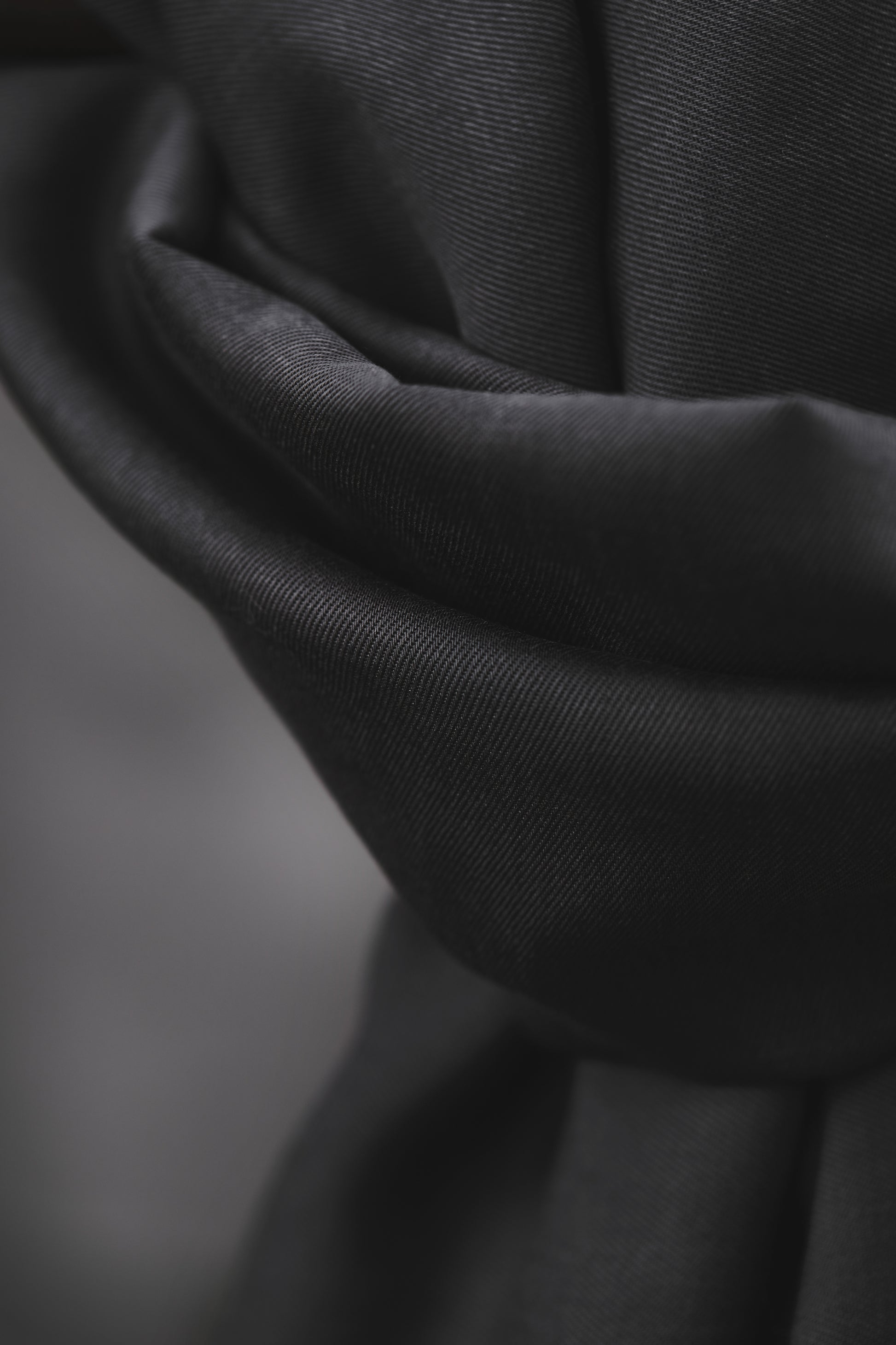 Close up of smooth drape twill tencel sewing fabric in anchor (grey)