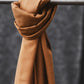 Smooth drape twill tencel sewing fabric knotted over clothes rail, in colour mustard
