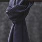 Smooth drape twill tencel sewing fabric in blueberry colour knotted over clothes rail