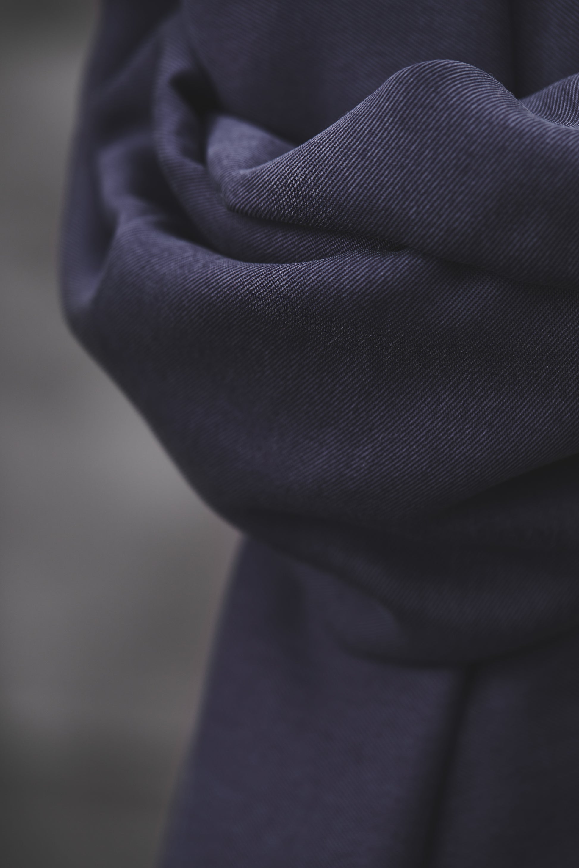 Close up of smooth drape twill tencel sewing fabric in blueberry