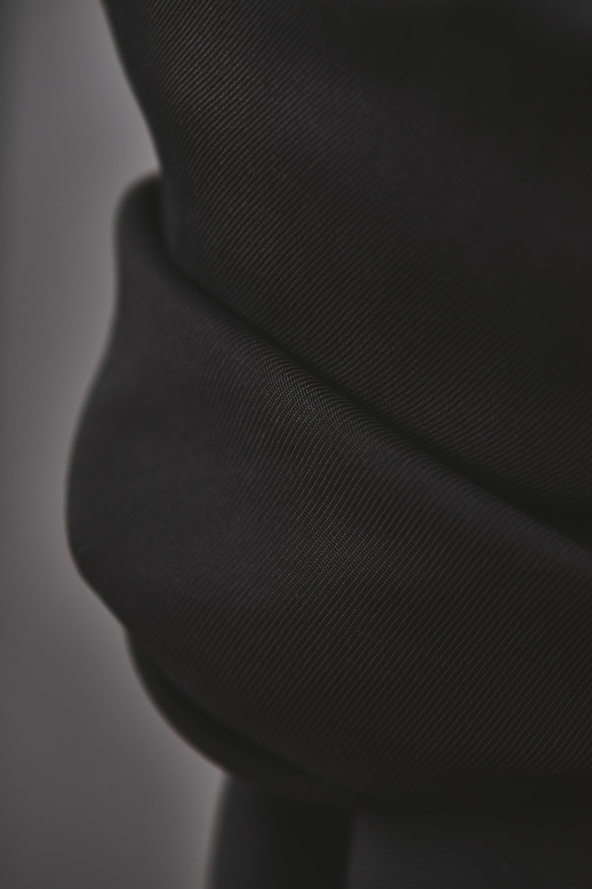 Close up of black tencel smooth drape twill sewing fabric