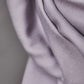 Close up of smooth drape twill tencel sewing fabric in colour purple haze (lilac)