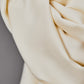Close up of smooth drape twill tencel fabric in shell (cream)