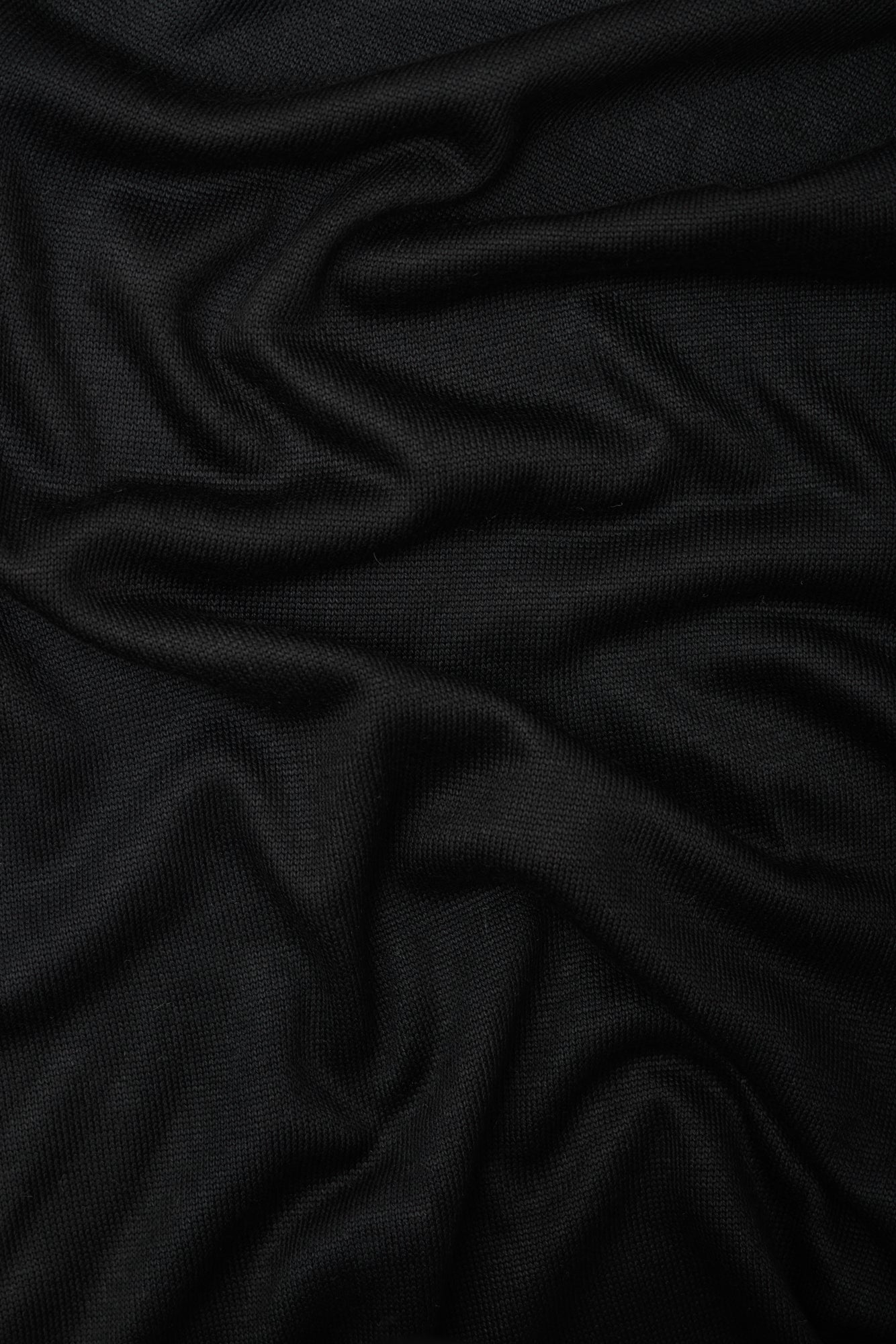 Close up of black Ecovero knit sewing fabric
