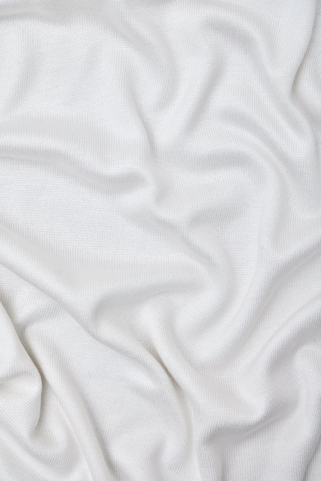 Close up of white Ecovero knit sewing fabric