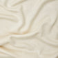 Close up of shell (cream) Ecovero knit sewing fabric