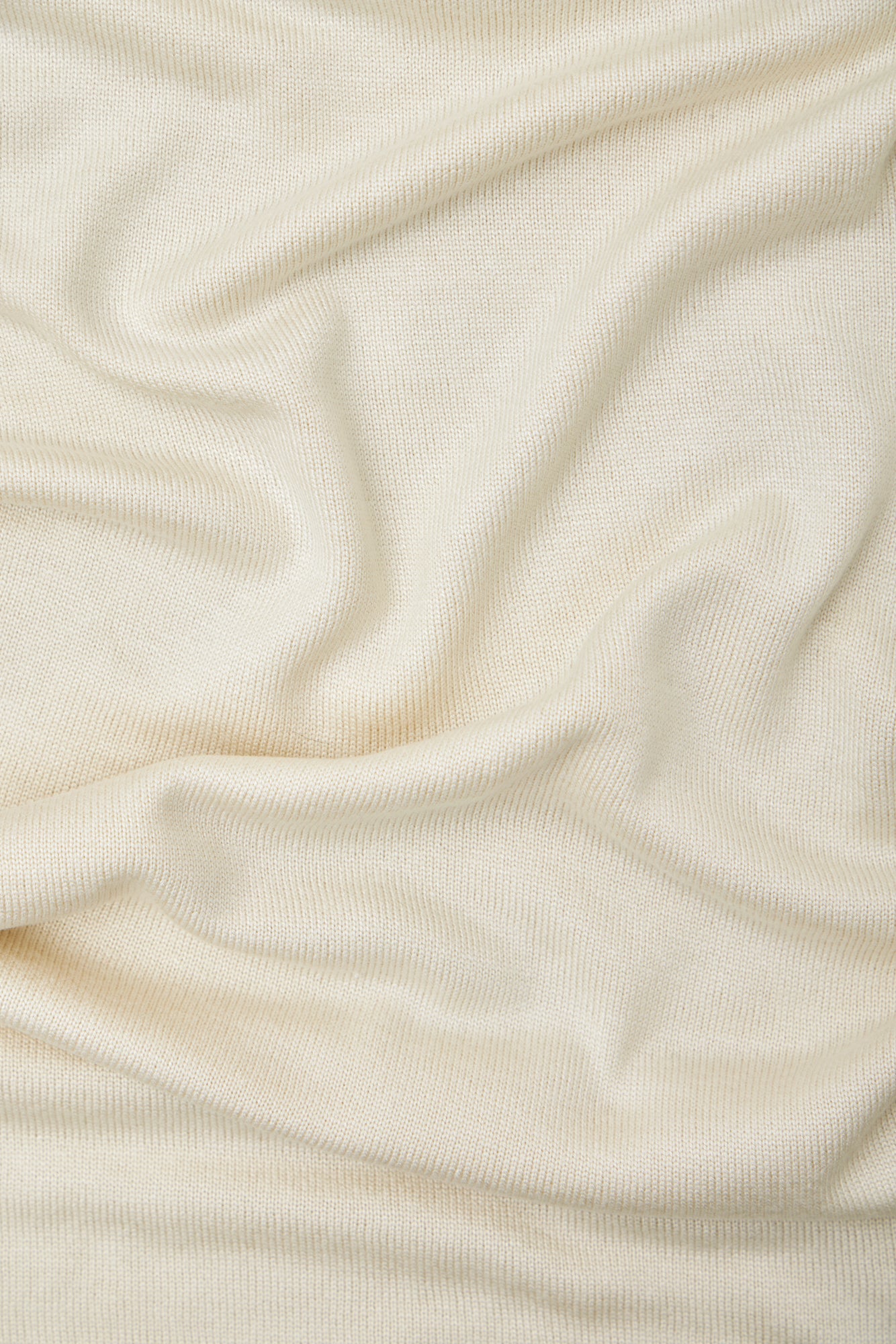 Close up of shell (cream) Ecovero knit sewing fabric