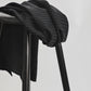 Sustainable tencel™ woven striped dressmaking fabric in black draped over stool