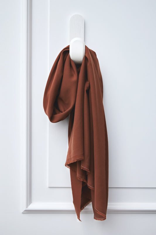 Vida Voile sustainable woven tencel fabric hanging on hook in colour pecan, brown