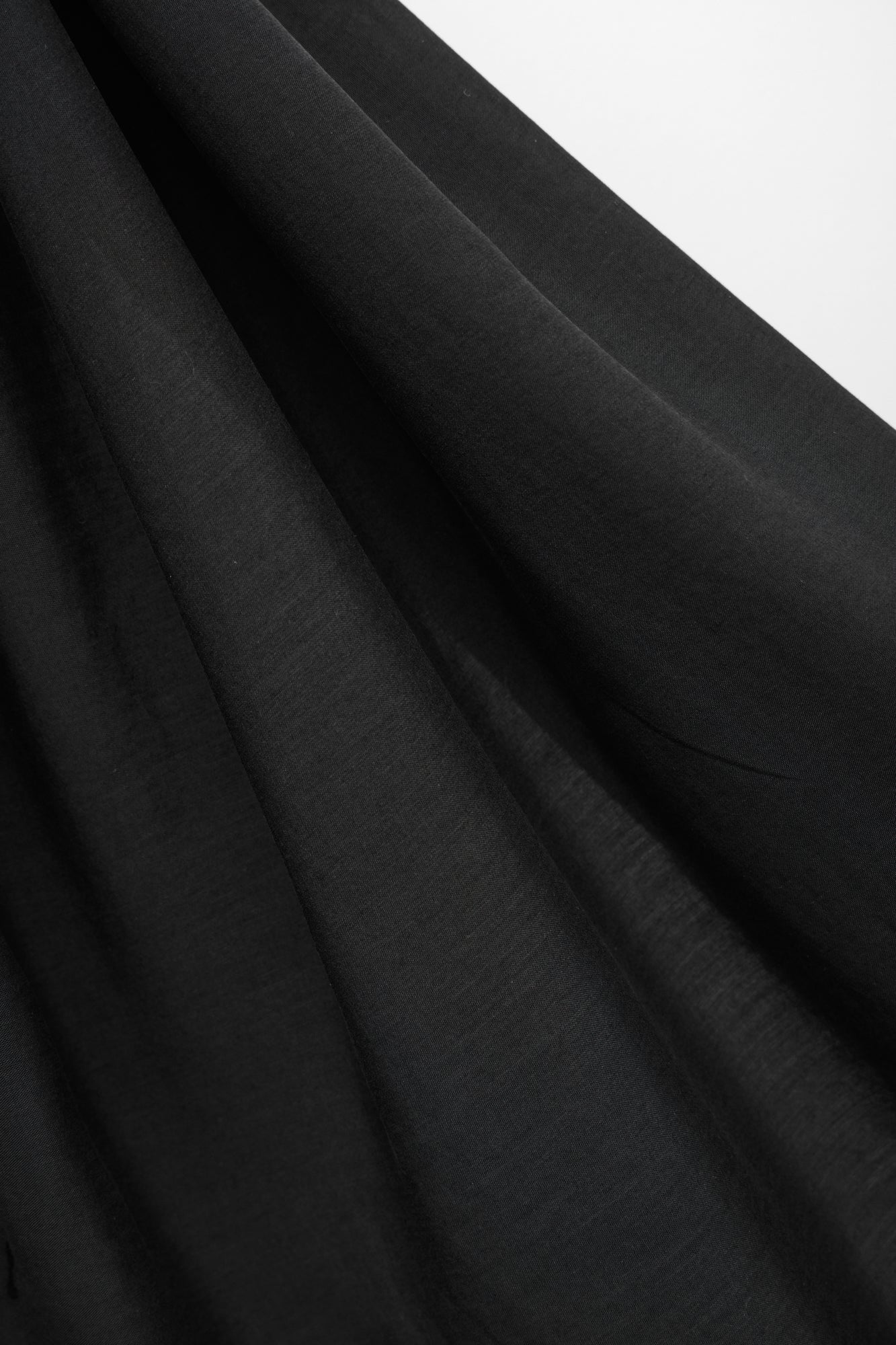 Close up of Vida voile tencel sewing fabric in black