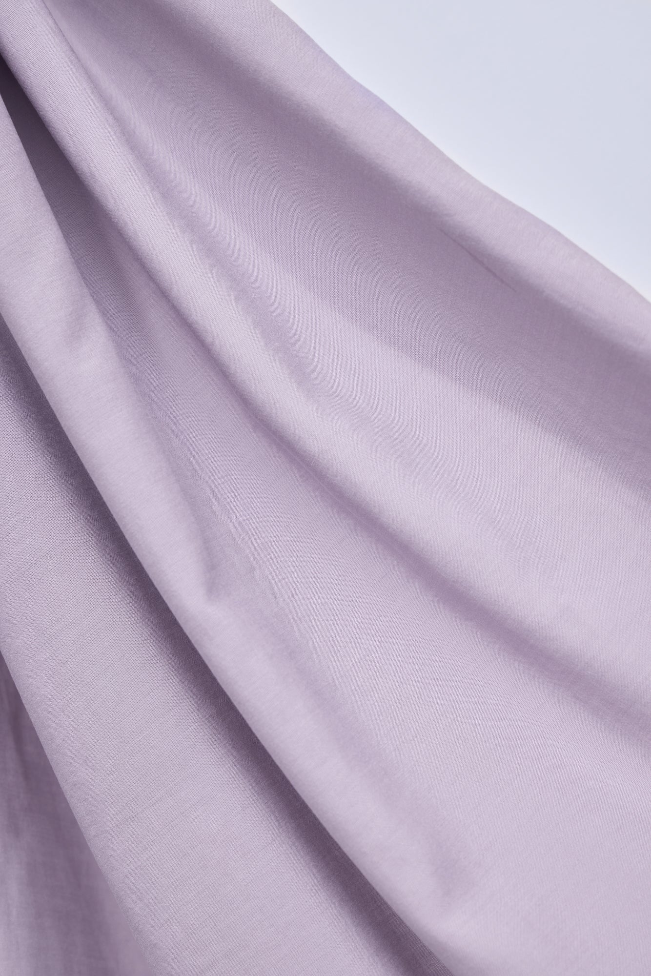 Close up of Vida voile tencel sewing fabric in colour purple haze